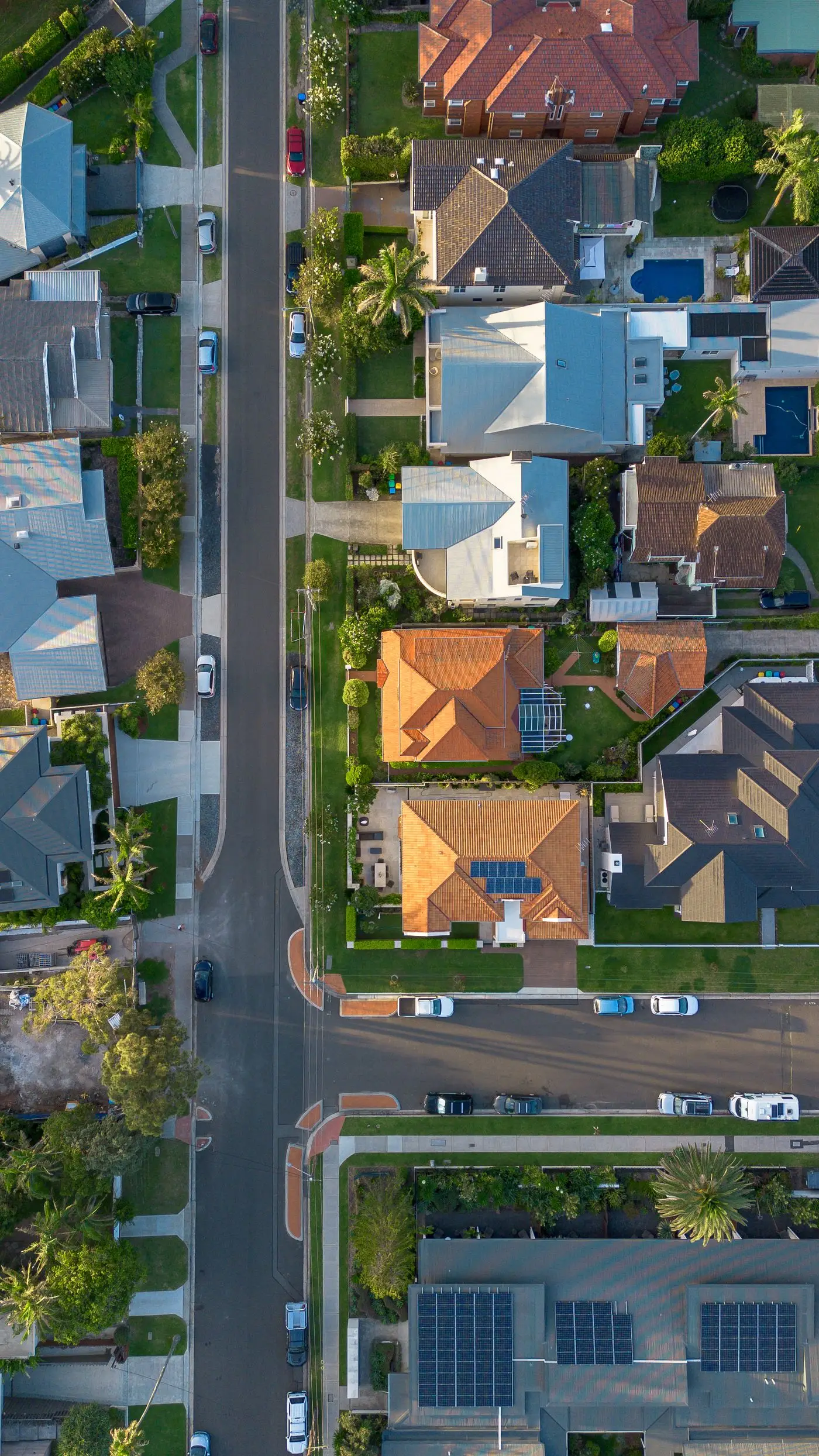 Aerial view of Australian suburban homes, one with a backyard pool